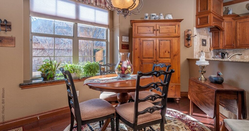 Freestanding pantry cabinet adjacent to kitchen