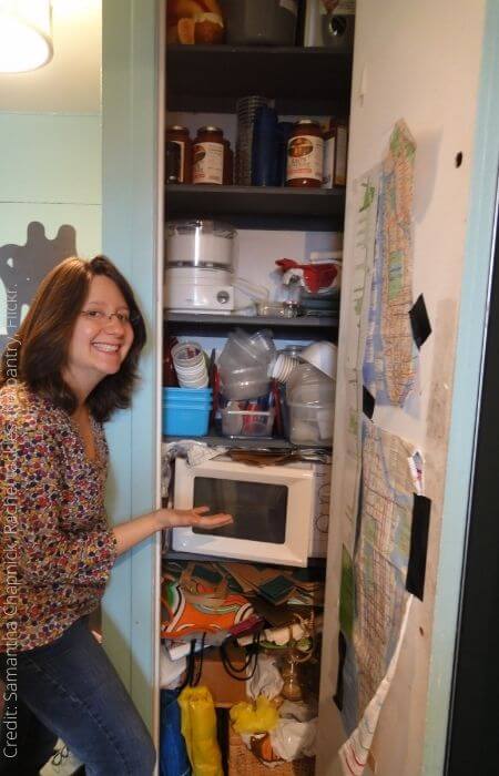 Woman about to clean her pantry.