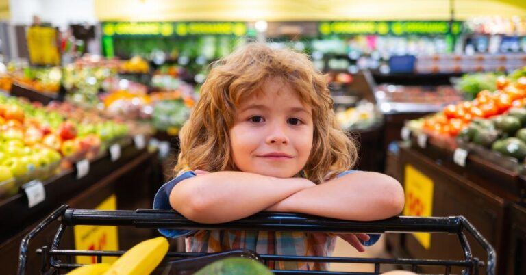 Child helping with grocery shopping.