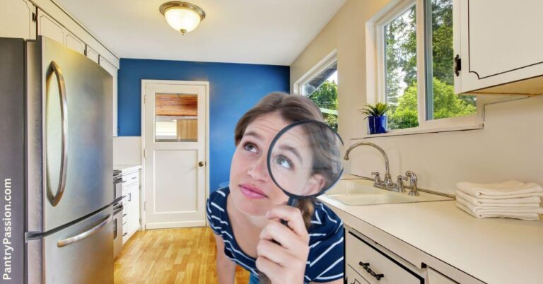 Woman with magnifying glass in her kitchen, trying to find more pantry space.