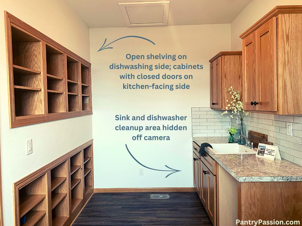 Hidden kitchen pass through via cabinets to kitchen sink area.