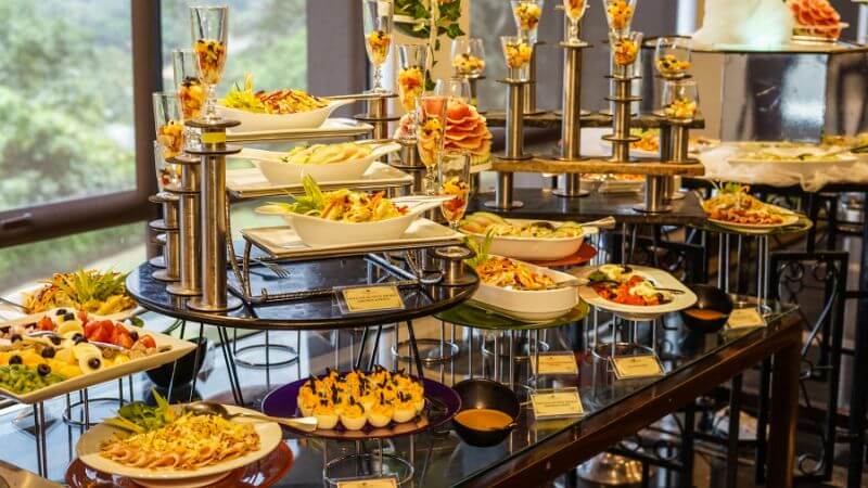 Buffet risers and tiered food displays on a buffet table - perfect for lifting a charcuterie board.