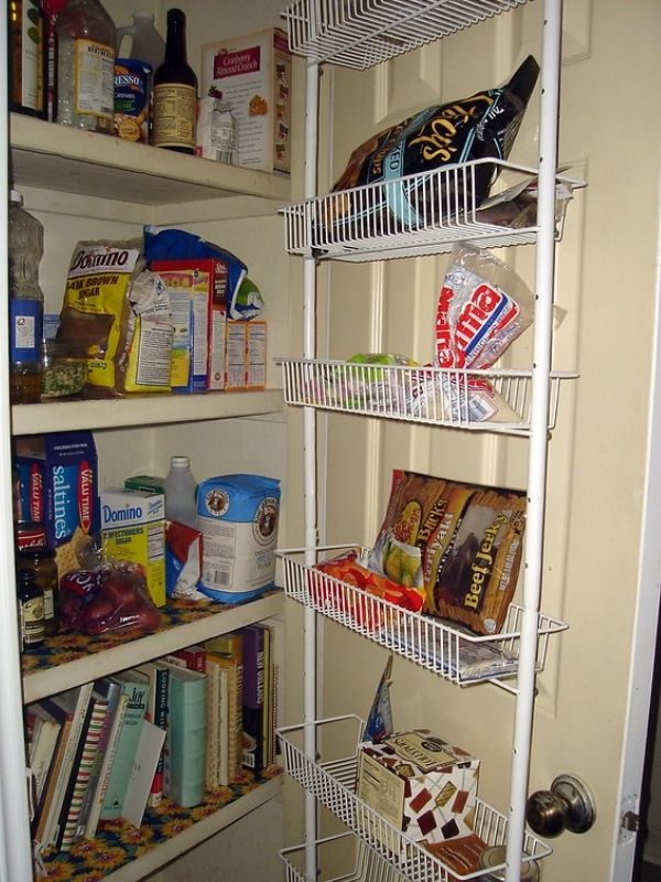 Rack over door offers more pantry storage.