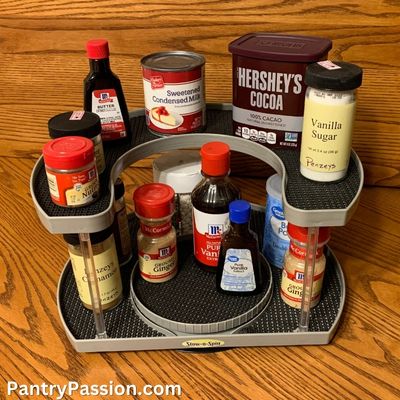 Lazy susan turntable shelf organizer with baking supplies.