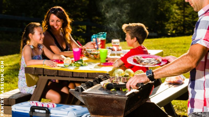family eating a camping meal that was prepared ahead of time