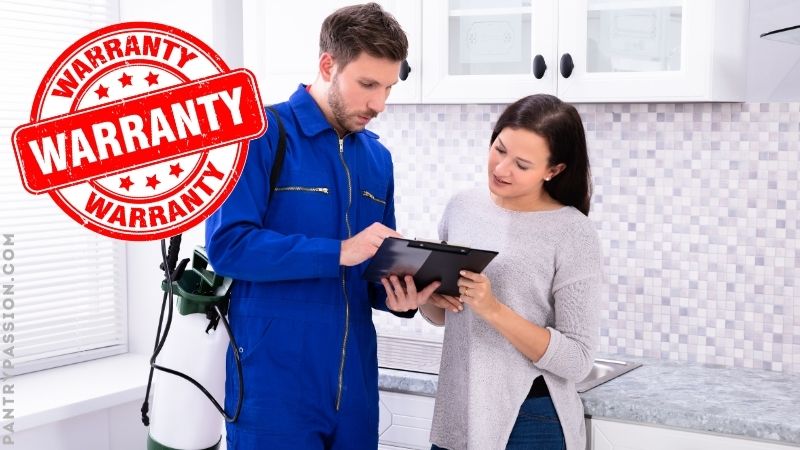 Mouse proofing services employee explaining to homeowner what is covered and the details of the warranty.