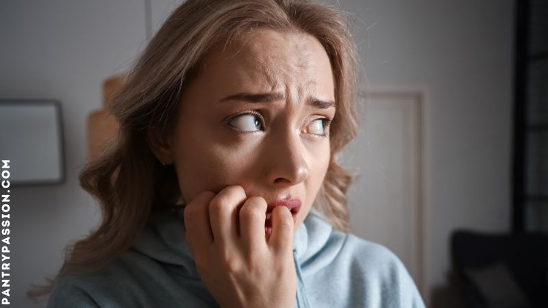 Woman experiencing panic attack after seeing a mouse.